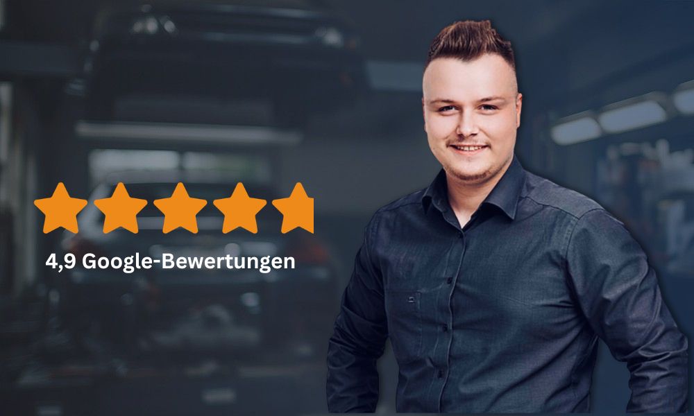 Mitrabeiter steht in einer Autowerkstatt
